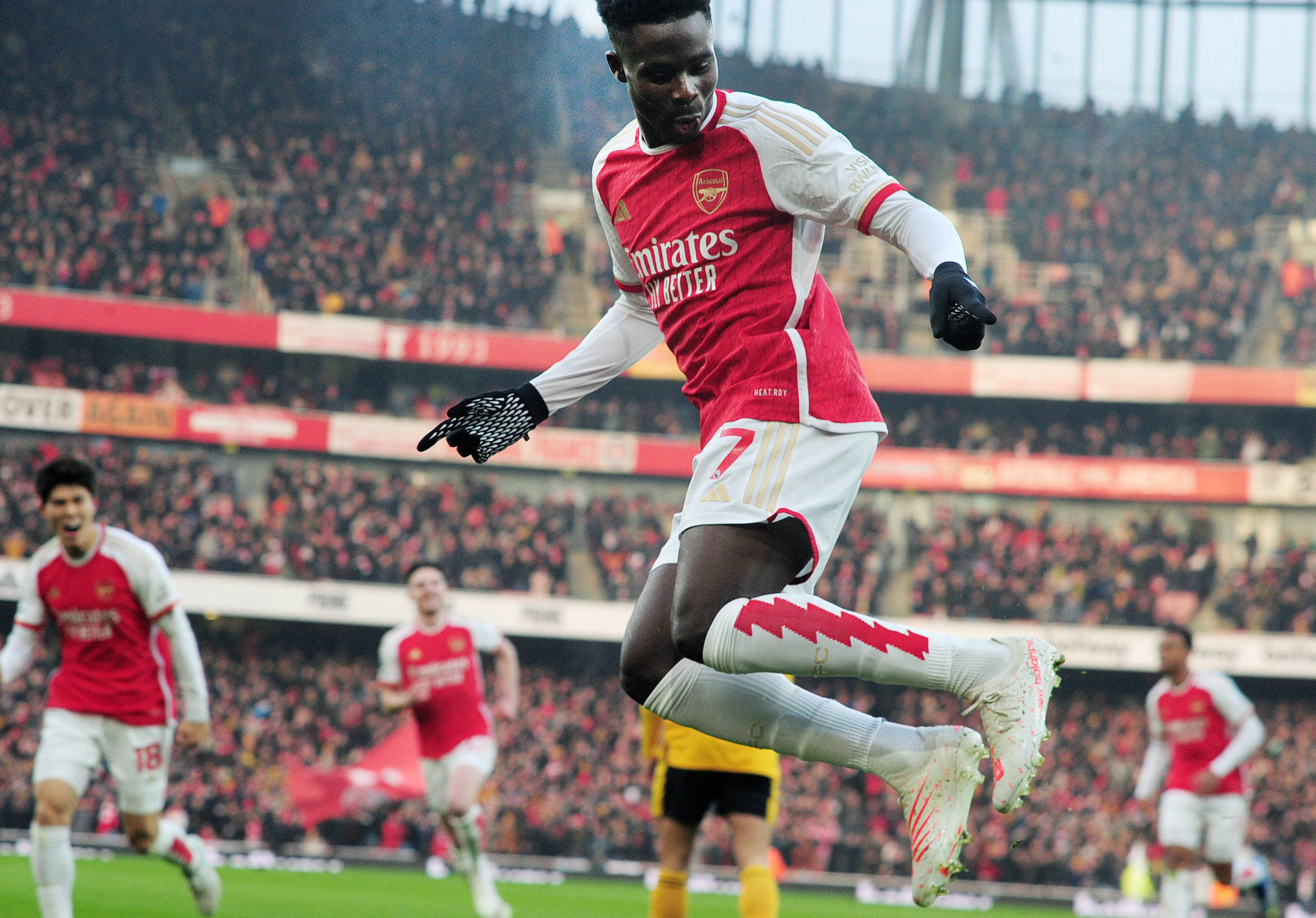 Bukayo Saka pictured celebrating after scoring for Arsenal in a 2-1 win over Wolves in December 2023